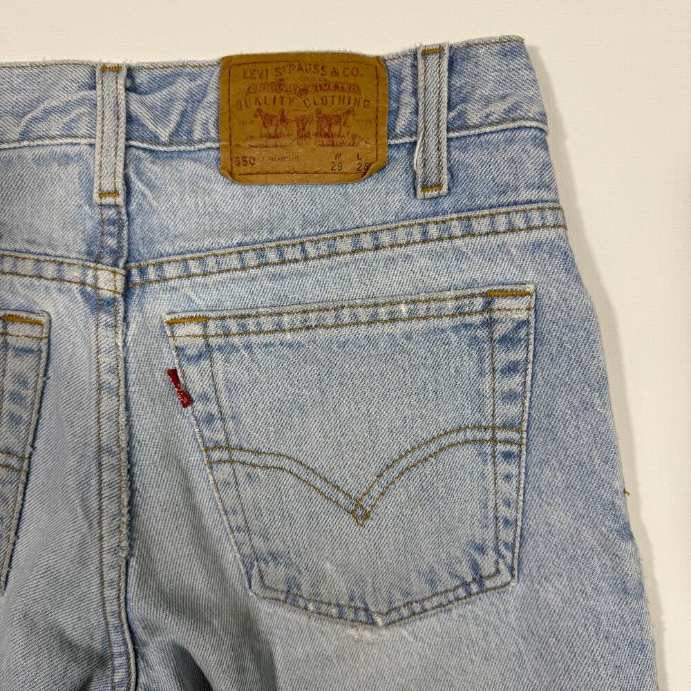 Vintage Levi's 550 Jeans Light Wash Distressed USA 29x25 Y2K